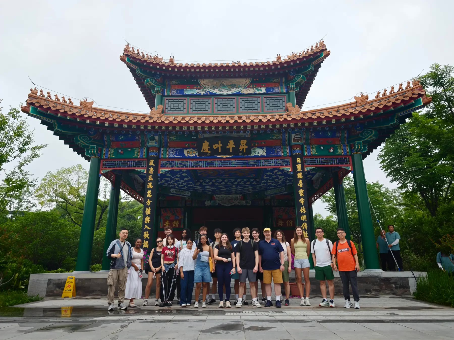 Bucknell in China participants beneath a traditional Chinese pavilion